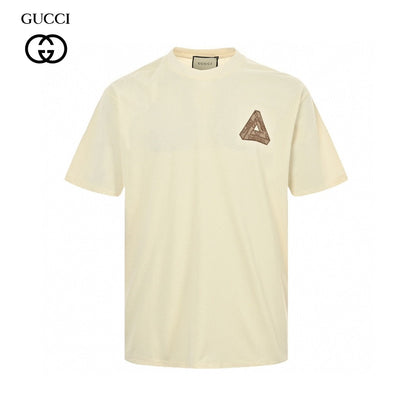 Gucci Triangle Logo T-shirt - Beige Unisex Streetwear Limited Edition - This Gucci t-shirt features a subtle triangle logo on the chest. The shirt is primarily