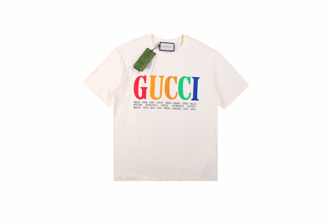 Gucci Cities Block Letter T-shirt - - White Unisex Streetwear Limited Edition - This white Gucci t-shirt proudly displays the 'GUCCI' logo in bold, colorful block letters across