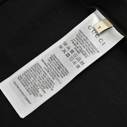 Camiseta negra de Gucci con estampado de dinosaurio rosa