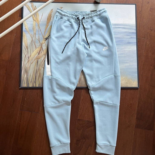 NIKE Tech Fleece Pants - Celestine - Blue Unisex Streetwear Limited Edition - The NIKE TECH FLEECE PANTS CELESTINE BLUE - REPLICA bring together modern athletic functionality and
