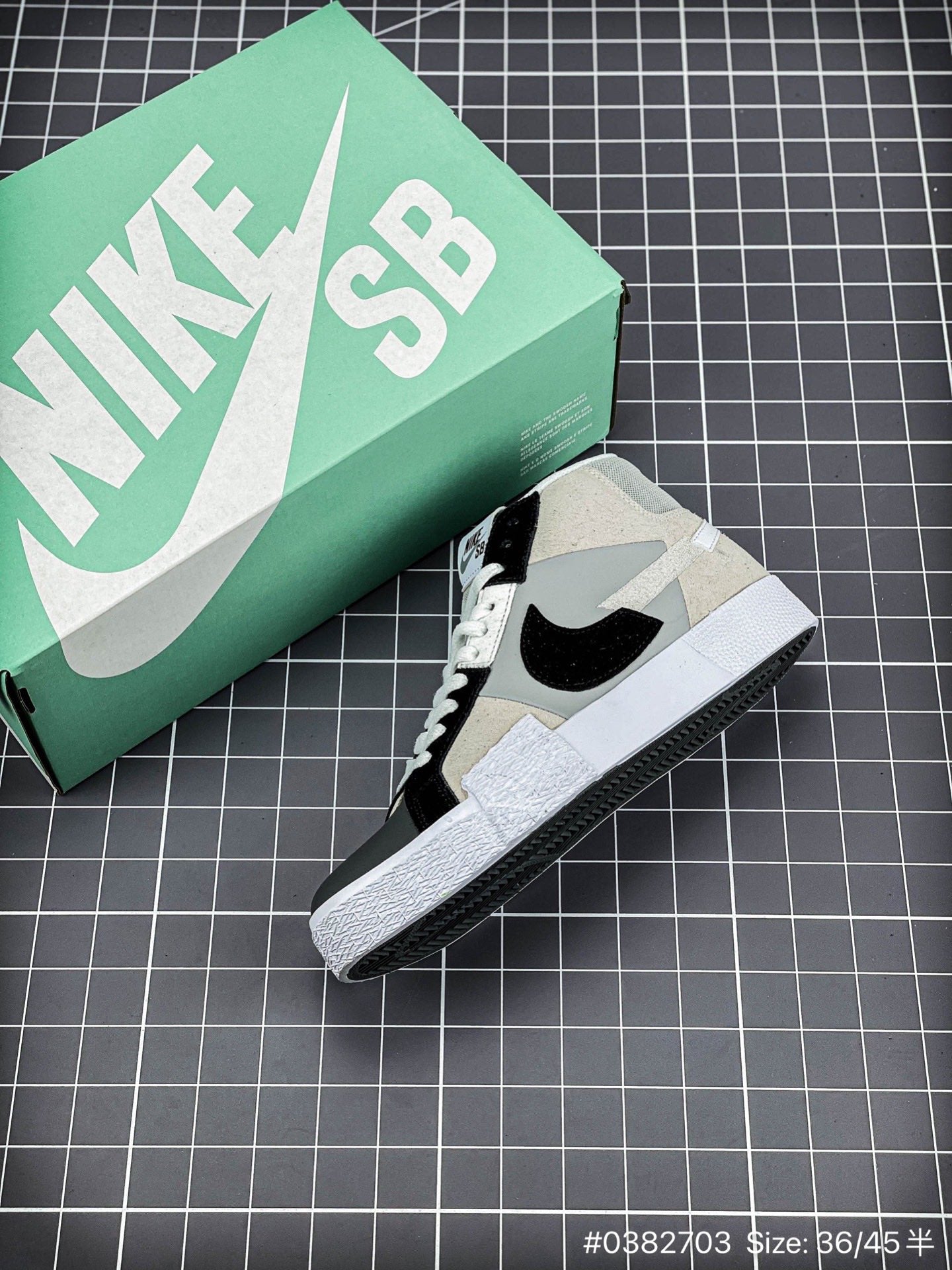 Nike Blazer Mid'1977 - Black Unisex Streetwear Limited Edition - The Nike Blazer High-Top '1977 'Mismatched Swoosh' in Grey and Black offers a bold and