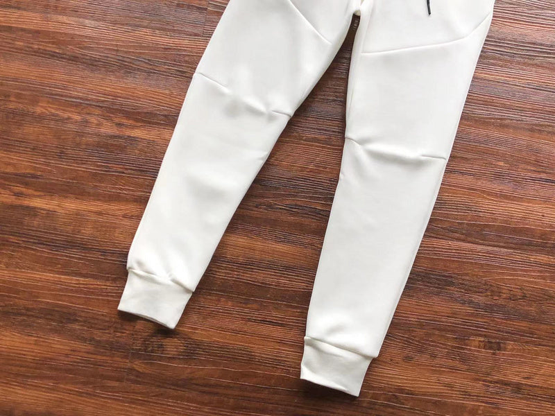 NIKE Tech Fleece Pants - - White Unisex Streetwear Limited Edition - The NIKE TECH FLEECE PANTS WHITE - REPLICA bring together modern athletic performance and sleek