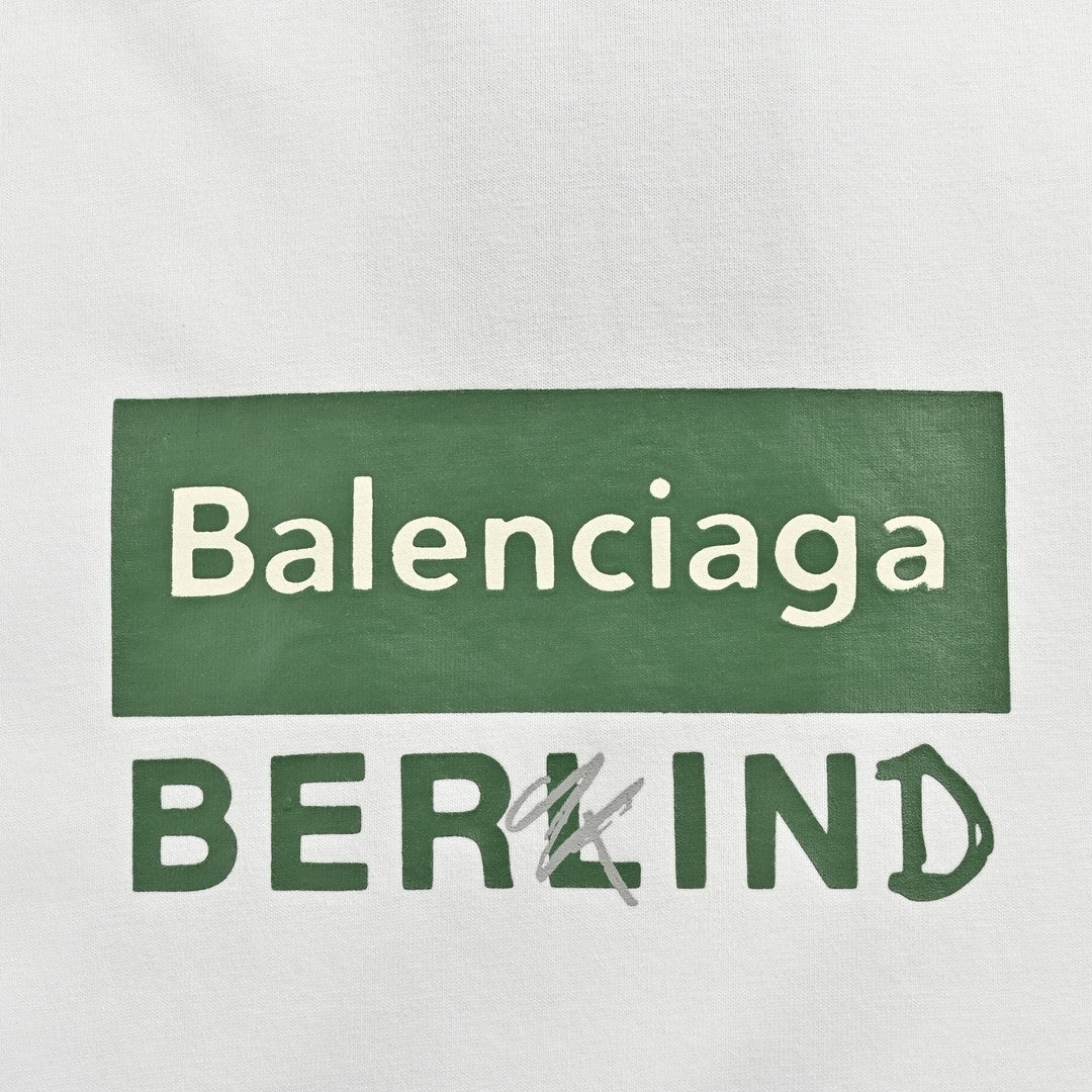 Balenciaga T-shirt - Berlin Graphic - White Unisex Streetwear Limited Edition - <span>This Balenciaga t-shirt features a minimalist design with the text 'Balenciaga' inside a green rectangular