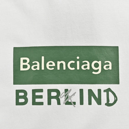 Balenciaga T-shirt - Berlin Graphic - White Unisex Streetwear Limited Edition - <span>This Balenciaga t-shirt features a minimalist design with the text 'Balenciaga' inside a green rectangular