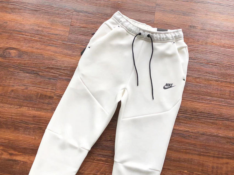NIKE Tech Fleece Pants - - White Unisex Streetwear Limited Edition - The NIKE TECH FLEECE PANTS WHITE - REPLICA bring together modern athletic performance and sleek