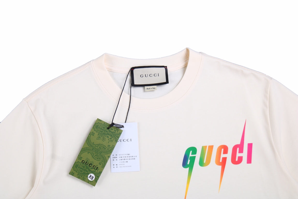 Gucci Lightning Logo T-shirt (cream) Unisex Streetwear Limited Edition - <p dir='ltr'><span>This Gucci t-shirt features a vibrant lightning logo design. The cream shirt showcases