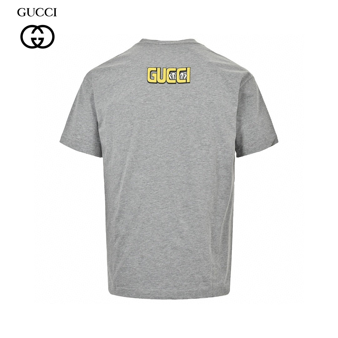 Gucci Cartoon Graphic T-shirt (grey) Unisex Streetwear Limited Edition - This grey Gucci T-shirt features a playful and vibrant cartoon graphic design. The front showcases