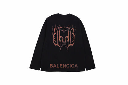 Balenciaga Long Sleeve T-shirt - Black Unisex Streetwear Limited Edition - Black long sleeve t-shirt with brown Balenciaga logo on the chest. Simple and minimalist design.