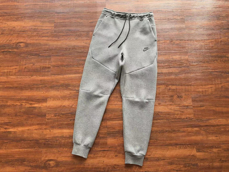 NIKE Tech Fleece Pants - Wolf - Grey Unisex Streetwear Limited Edition - The NIKE TECH FLEECE PANTS WOLF GREY - REPLICA blend modern athletic performance with sleek