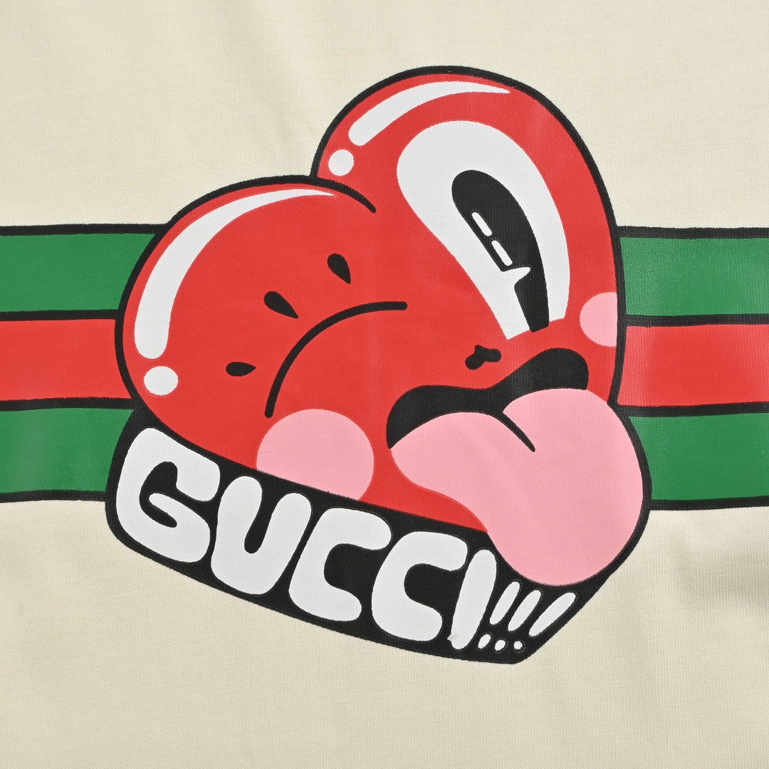 Gucci T-shirt With Heart Graphic - Cream Unisex Streetwear Limited Edition - <span>Playful and stylish. Features a red heart cartoon graphic. Green and red stripe design with