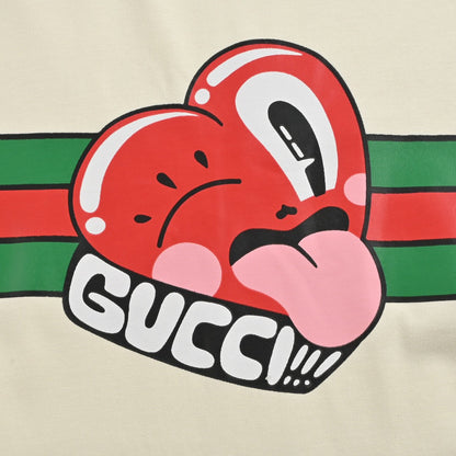 Gucci T-shirt With Heart Graphic - Cream Unisex Streetwear Limited Edition - <span>Playful and stylish. Features a red heart cartoon graphic. Green and red stripe design with