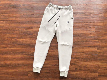 NIKE Tech Fleece Pants - Creamy - White Unisex Streetwear Limited Edition - The NIKE TECH FLEECE PANTS CREAMY WHITE - REPLICA offer the perfect combination of modern