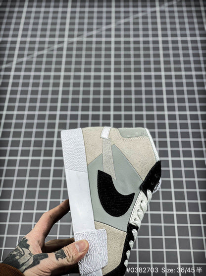 Nike Blazer Mid'1977 - Black Unisex Streetwear Limited Edition - The Nike Blazer High-Top '1977 'Mismatched Swoosh' in Grey and Black offers a bold and