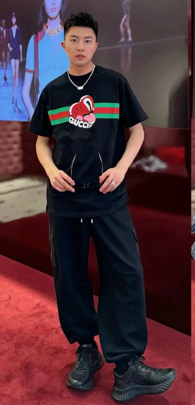 Gucci T-shirt With Heart Graphic - Black Unisex Streetwear Limited Edition - <span>Playful and stylish. Features a red heart cartoon graphic. Green and red stripe design with