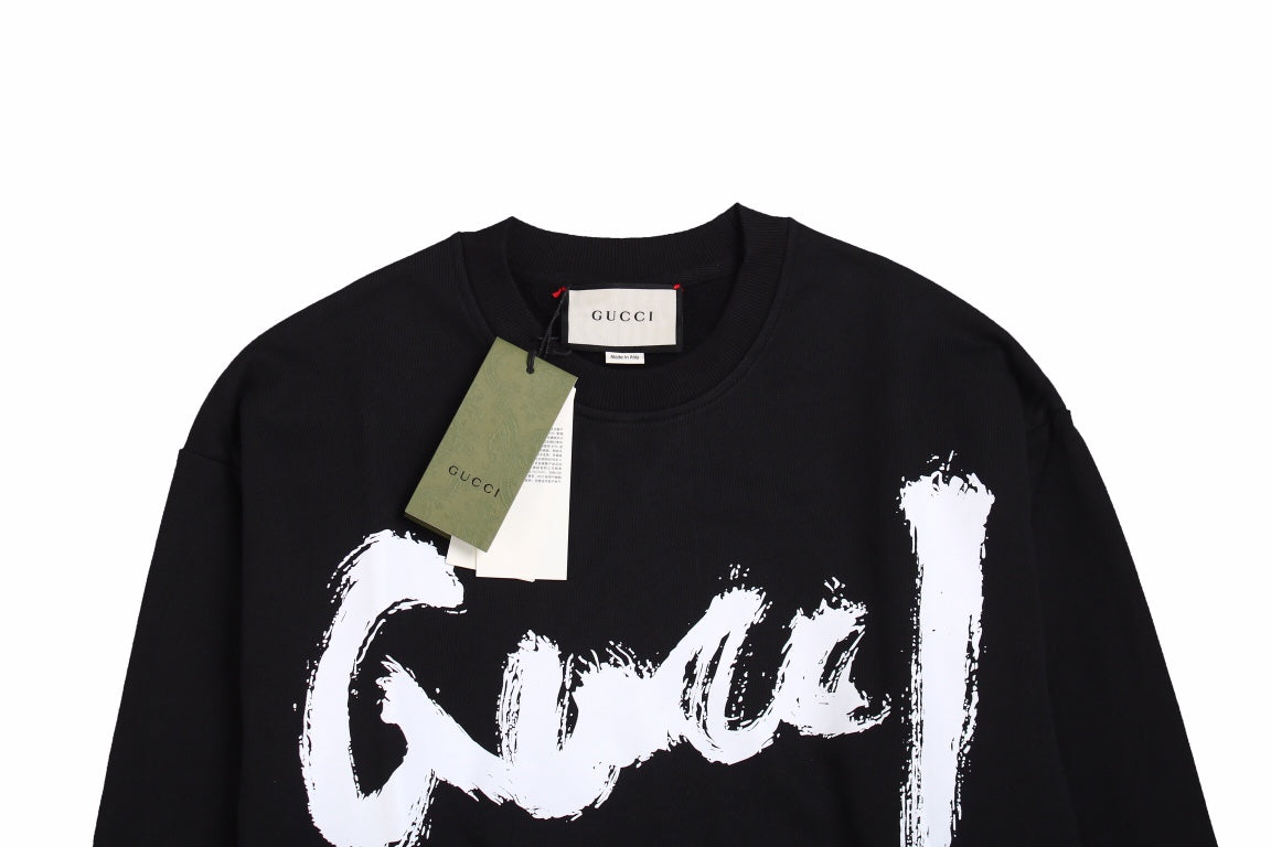 Gucci Sweatshirt - Black Unisex Streetwear Limited Edition - Black sweatshirt with a bold, brushstroke-style 'Gucci' logo in white. Features ribbed cuffs and hem