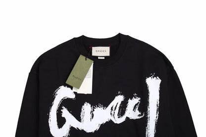 Gucci Sweatshirt - Black Unisex Streetwear Limited Edition - Black sweatshirt with a bold, brushstroke-style 'Gucci' logo in white. Features ribbed cuffs and hem