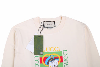 Gucci Donald Duck Sweatshirt - - Cream Unisex Streetwear Limited Edition - This cream-colored Gucci sweatshirt features a playful graphic of Donald Duck paired with the iconic