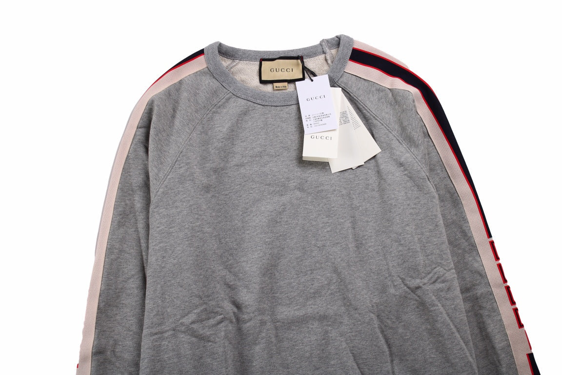 Gucci Sweatshirt With Stripe Detail - Grey Unisex Streetwear Limited Edition - This Gucci sweatshirt features a grey design with colorful stripe details along the sleeves. It