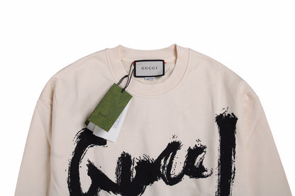 Gucci Sweatshirt - Black Unisex Streetwear Limited Edition - Cream-colored sweatshirt with a bold, brushstroke-style 'Gucci' logo in black. Features ribbed cuffs and hem