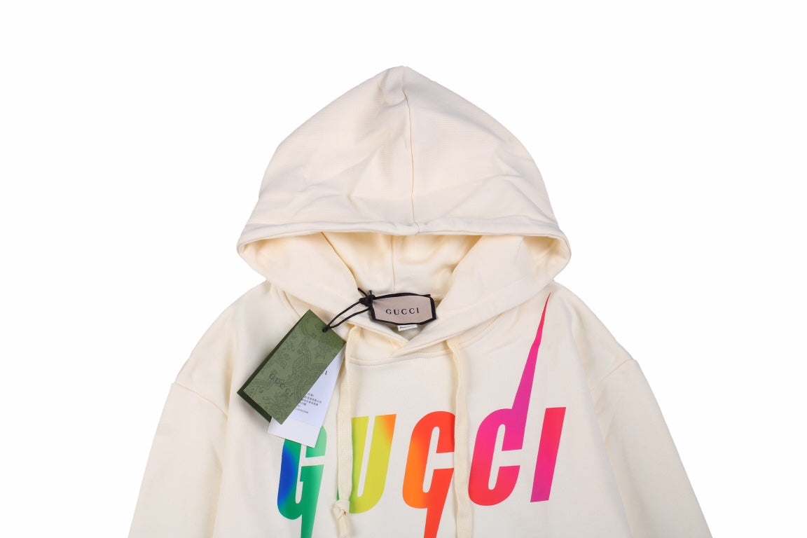 Gucci Rainbow Logo Hoodie - - Cream Unisex Streetwear Limited Edition - This cream-colored Gucci hoodie features a striking rainbow 'GUCCI' logo on the front. It has