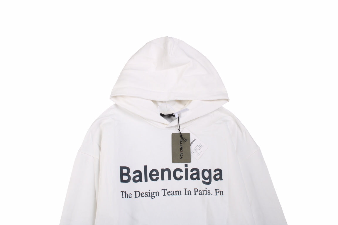 Balenciaga Paris Team Hoodie - White Unisex Streetwear Limited Edition - This Balenciaga hoodie in white features the text 'Balenciaga The Design Team In Paris. Fn'