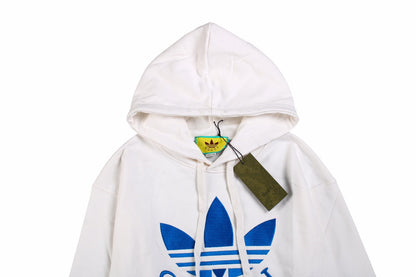 Gucci - Adidas Hoodie - White Unisex Streetwear Limited Edition - This Gucci x Adidas hoodie is crafted in white fabric, featuring the iconic blue Adidas