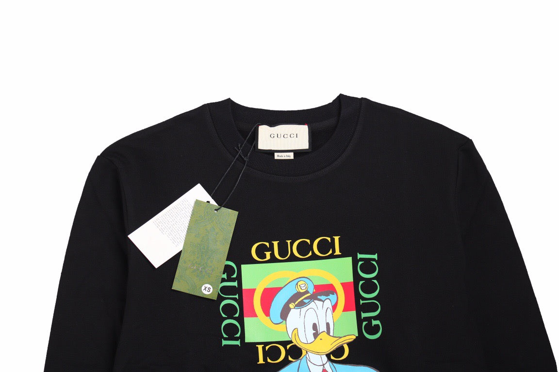 Gucci Donald Duck Sweatshirt - - Black Unisex Streetwear Limited Edition - This black Gucci sweatshirt features a vibrant graphic of Donald Duck along with the iconic