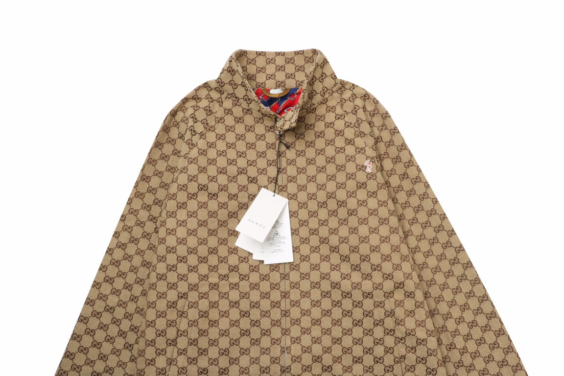Gucci Monogram Track Jacket - Red Unisex Streetwear Limited Edition - This Gucci track jacket showcases the iconic Gucci monogram pattern in a classic brown color.
