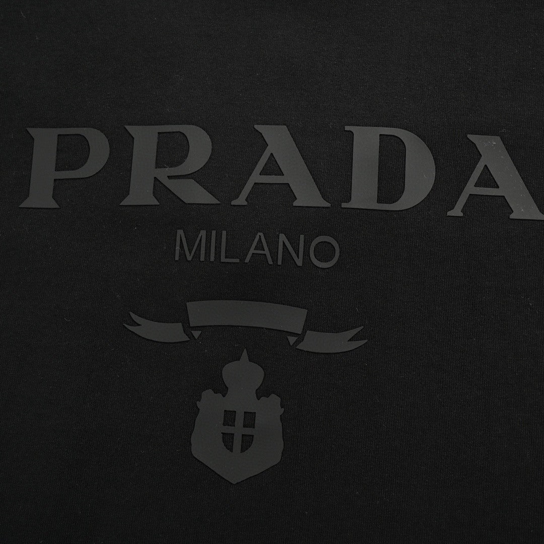 Prada T-shirt - With Subtle Branding - Black Unisex Streetwear Limited Edition - <span>This Prada t-shirt features a sleek black base with understated 'PRADA MILANO' branding across the