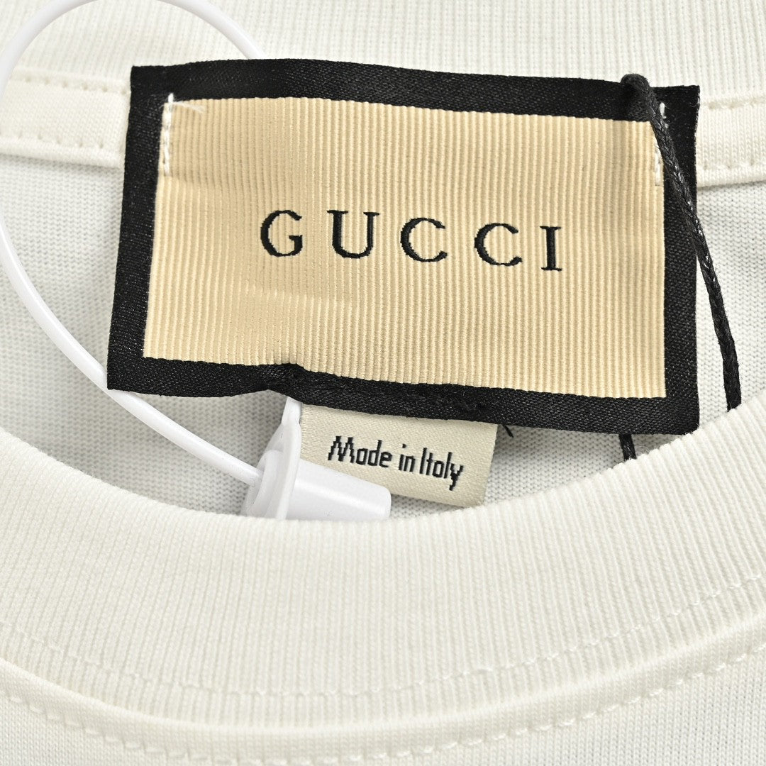 Gucci Smiley Face T-shirt - Yellow Unisex Streetwear Limited Edition - <span>This Gucci t-shirt features a playful design with a large yellow smiley face graphic on