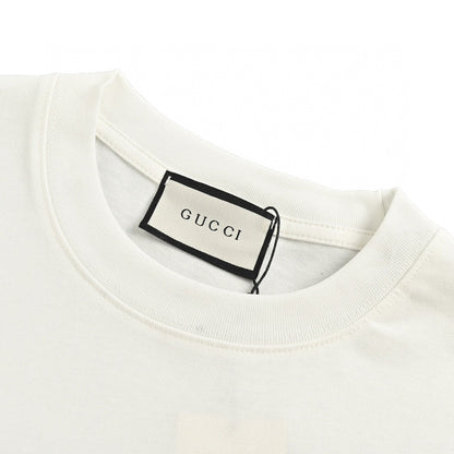 Gucci T-shirt - Scribble Logo - White Unisex Streetwear Limited Edition - <span>This Gucci t-shirt features a distinctive design with the iconic Gucci logo in a scribble