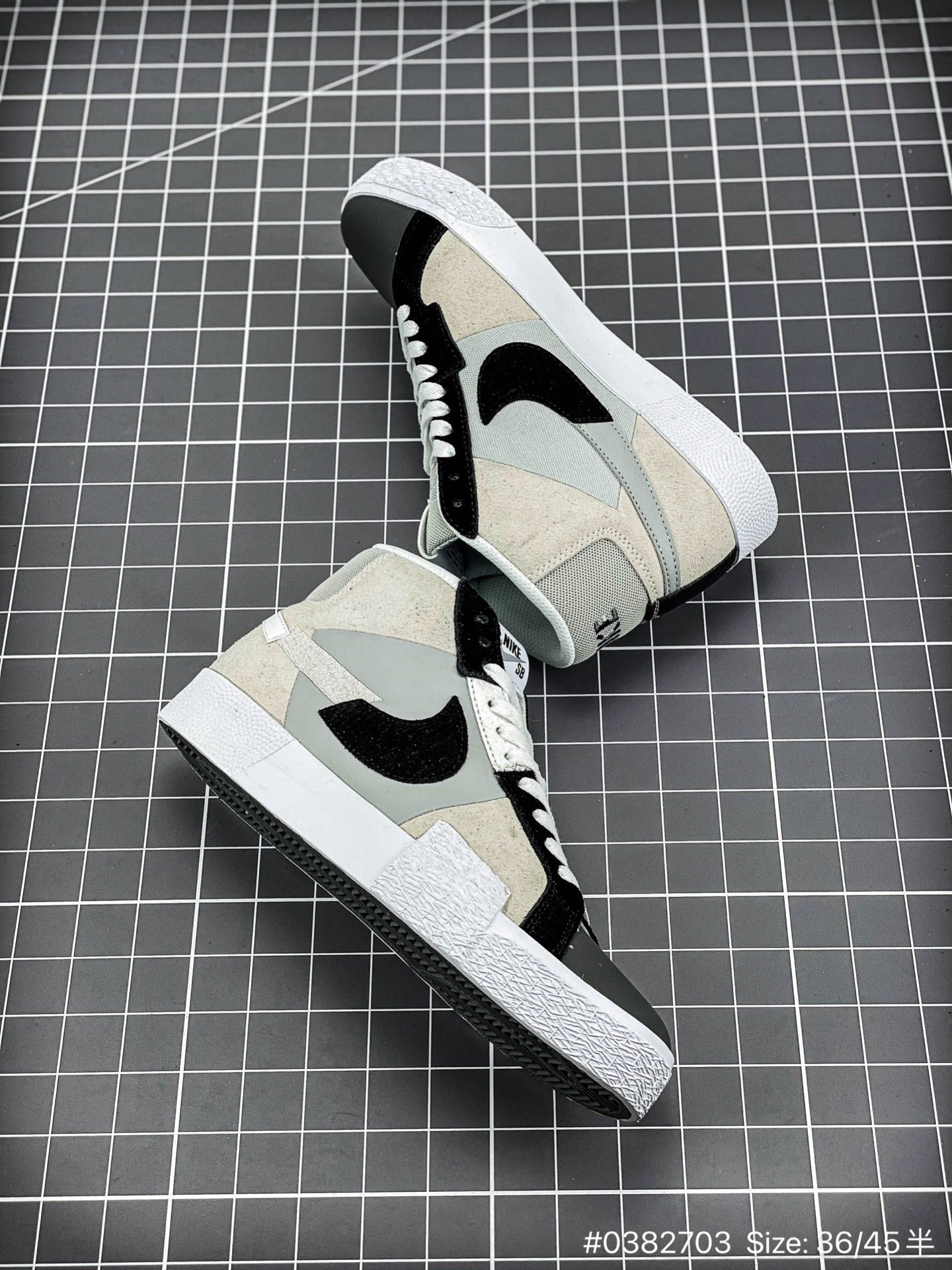 Nike Blazer Mid'1977 - Black Unisex Streetwear Limited Edition - The Nike Blazer High-Top '1977 'Mismatched Swoosh' in Grey and Black offers a bold and