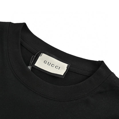Gucci T-shirt - Scribble Logo - Black Unisex Streetwear Limited Edition - <span>This Gucci t-shirt features a distinctive design with the iconic Gucci logo in a scribble