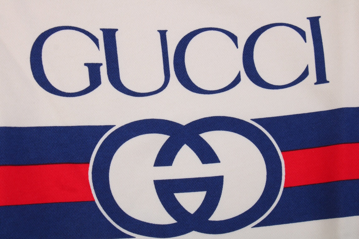 Gucci Sweatshirt - Red Unisex Streetwear Limited Edition - Cream sweatshirt with bold GUCCI logo. Blue and red stripe detailing across chest and sleeves.