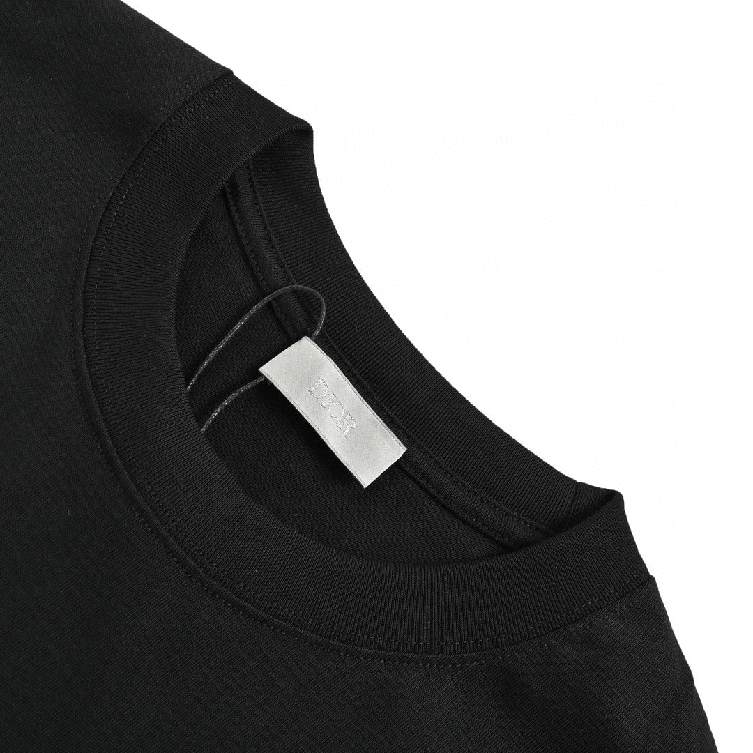 Dior Christian Dior Graphic T-shirt - Black Unisex Streetwear Limited Edition - This Dior t-shirt features a bold graphic design with 'Christian Dior' text and star-like elements.