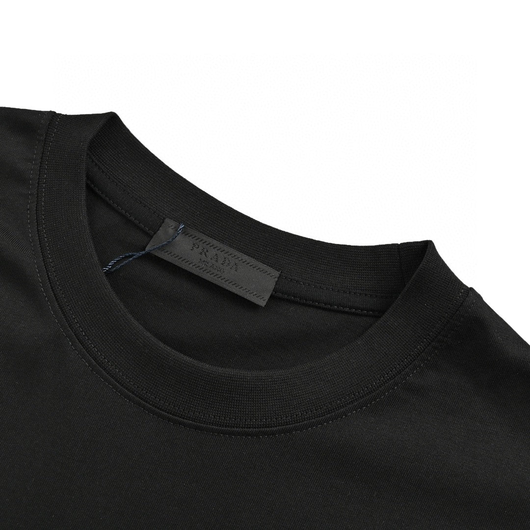 Prada T-shirt - Black Unisex Streetwear Limited Edition - This Prada t-shirt features a minimalist black design. It has the Prada Milano logo printed