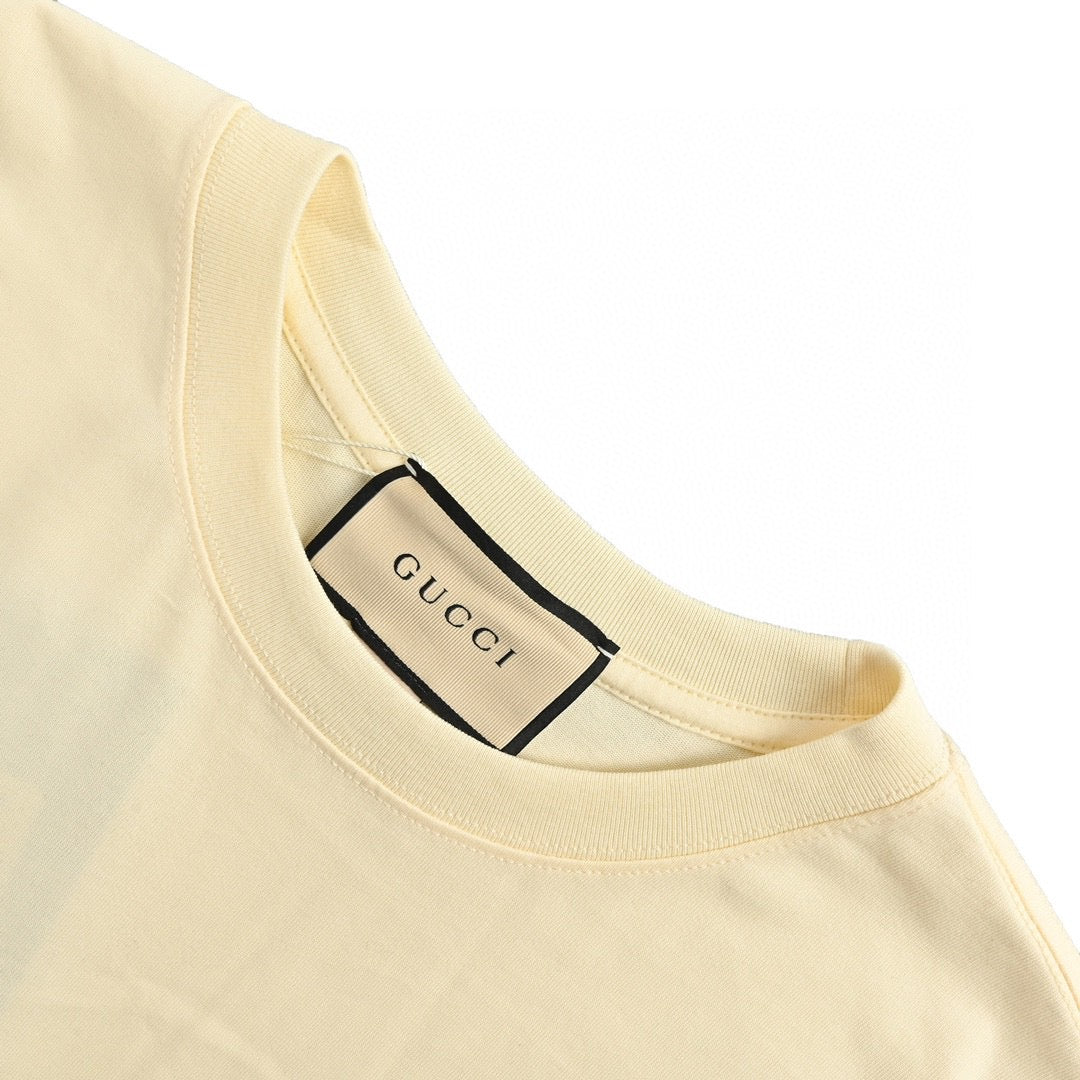 Gucci Strawberry Logo T-shirt (beige) Unisex Streetwear Limited Edition - The Gucci Strawberry Logo T-Shirt in beige features a playful and artistic design that embodies