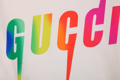 Gucci Rainbow Logo Hoodie - - Cream Unisex Streetwear Limited Edition - This cream-colored Gucci hoodie features a striking rainbow 'GUCCI' logo on the front. It has