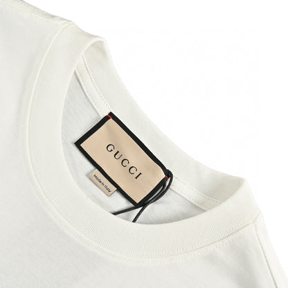 Gucci Embellished T-shirt - White Unisex Streetwear Limited Edition - This Gucci t-shirt features a stylish design with the Gucci logo and small black dot