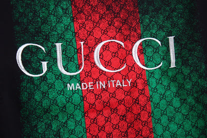 Gucci Sweatshirt - Black Unisex Streetwear Limited Edition - Black sweatshirt featuring the iconic Gucci green and red web design. Overlaid with the 'GUCCI'