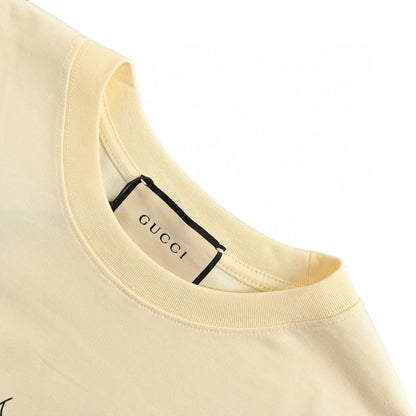 Gucci Cartoon Cow Logo T-shirt (cream) Unisex Streetwear Limited Edition - The Gucci Cartoon Cow Logo T-Shirt in cream is a fun and playful piece that