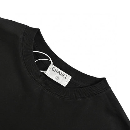 Chanel Pink Splash Logo T-shirt - Black Unisex Streetwear Limited Edition - This Chanel t-shirt features a large pink logo with a splash paint effect, complemented by