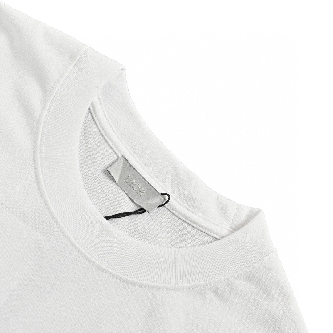 Dior Christian Dior Graphic T-shirt - White Unisex Streetwear Limited Edition - This Dior t-shirt features a bold graphic design with 'Christian Dior' text and star-like elements.