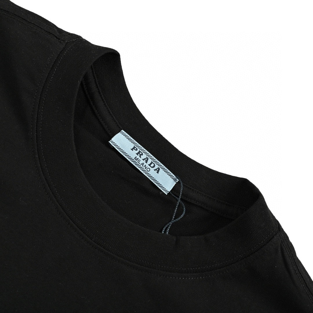 Prada T-shirt - Black Unisex Streetwear Limited Edition - This Prada t-shirt features a sleek black design. It has a small chest pocket with