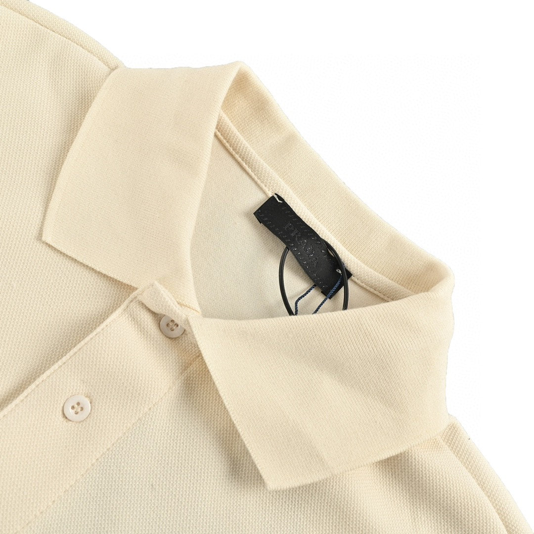 Prada Polo Shirt - Cream Unisex Streetwear Limited Edition - This Prada polo shirt features a simple yet elegant cream design. The shirt is adorned