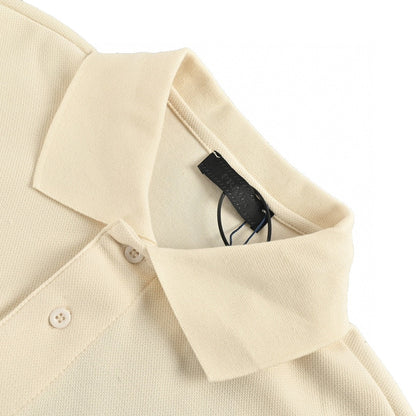 Prada Polo Shirt - Cream Unisex Streetwear Limited Edition - This Prada polo shirt features a simple yet elegant cream design. The shirt is adorned