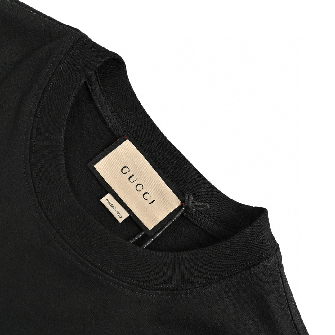 Gucci Embellished T-shirt - Black Unisex Streetwear Limited Edition - This Gucci t-shirt features a stylish design with the Gucci logo and small white dot