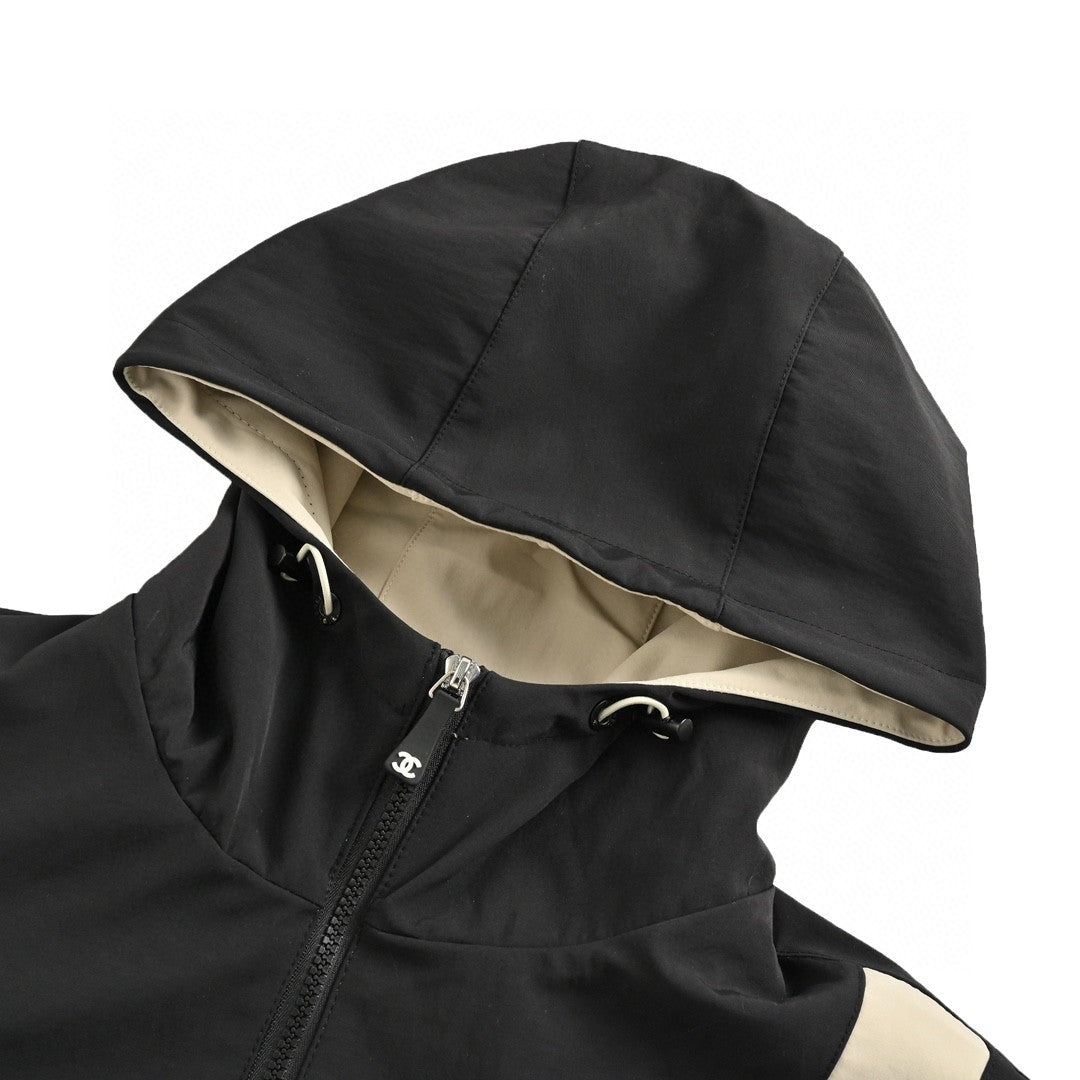 Chanel Two-tone Hooded Jacket - Black Unisex Streetwear Limited Edition - This Chanel jacket features a stylish black and beige two-tone design. It has a front