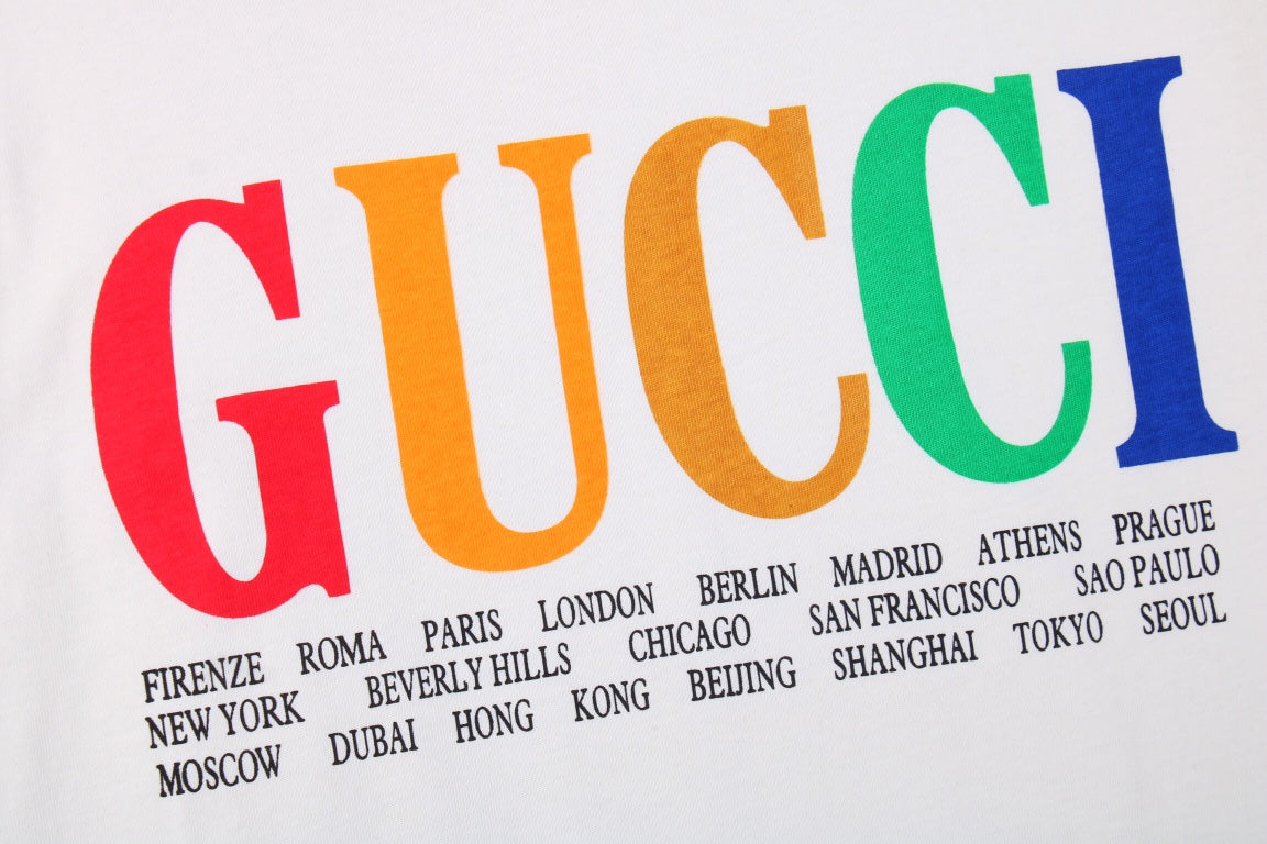 Gucci Cities Block Letter T-shirt - - White Unisex Streetwear Limited Edition - This white Gucci t-shirt proudly displays the 'GUCCI' logo in bold, colorful block letters across