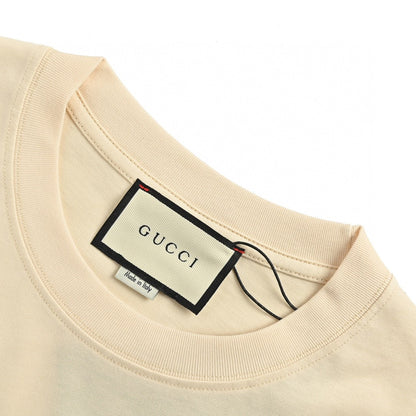 Gucci Dragon Graphic T-shirt (beige) Unisex Streetwear Limited Edition - This beige Gucci T-shirt stands out with its bold dragon graphic design. The top features